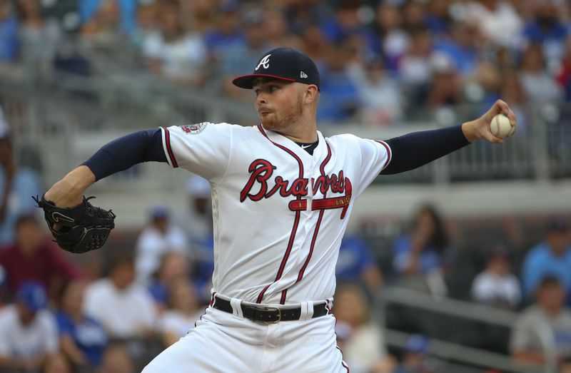 Braves starting pitcher Sean Newcomb works against the Los Angeles Dodgers on Thursday, Aug. 3, 2017, in Atlanta. (AP Photo/John Bazemore)