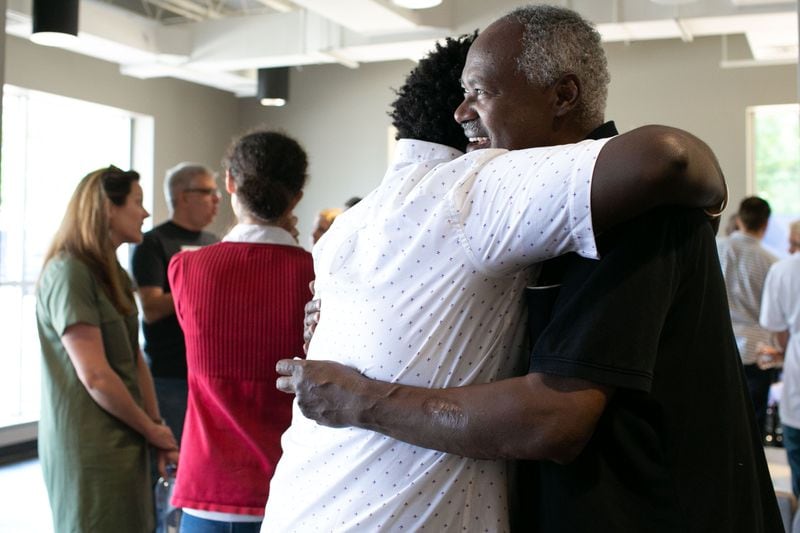 Pastor Tegga Lendado hugs an attendee before Rally for Resettlement, a solidarity event for refugees and agencies, held at Clarkston International Bible Church in Clarkston, Georgia, on Saturday, Sept. 28, 2019. (Photo: Rebecca Wright / Special to the AJC)