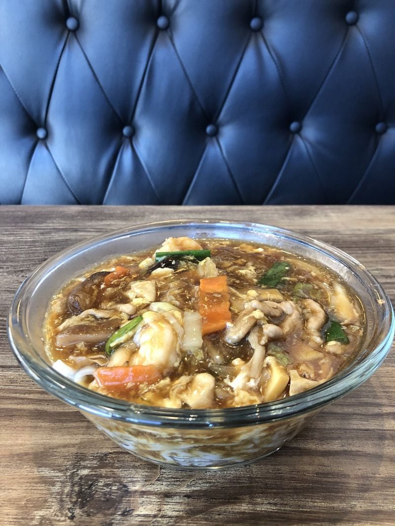 The pork and shrimp gravy noodle soup at Xiao’s Way Noodle House in Johns Creek is more like a stew. CONTRIBUTED BY WENDELL BROCK
