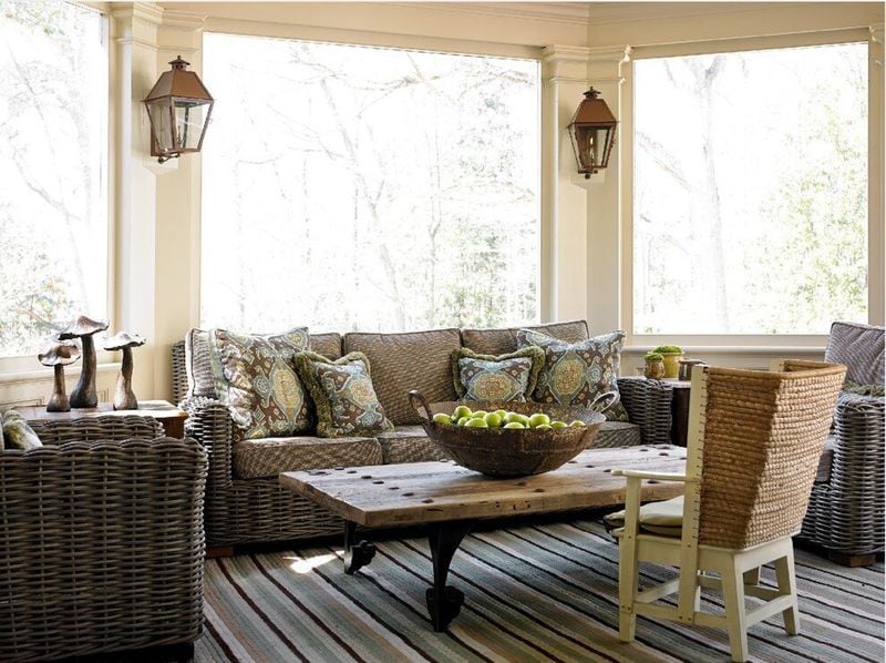 A screened in porch designed by Atlanta's Liz Williams incorporates a variety of brown tones balanced by natural sunlight.
(Courtesy of Liz Williams Interiors. Photo by Emily Followill)