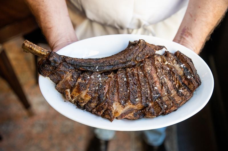 The 18-ounce prime bone-in ribeye fills the plate at Helen in Birmingham, Alabama. 
Courtesy of Caleb Chancey