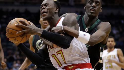 Atlanta Hawks' Dennis Schroder is fouled by Milwaukee Bucks' Tony Snell during the second half of an NBA basketball game Friday, March 24, 2017, in Milwaukee. (AP Photo/Morry Gash)