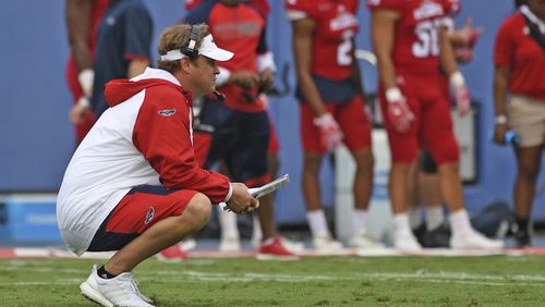 New Florida Atlantic coach Lane Kiffin watches players Saturday, April 22, 2017, in Boca Raton, Fla. Kiffin is at a school coming off three consecutive 3-9 seasons instead of being with a Crimson Tide program that will almost certainly find its way into the national-title conversation again this year. And while Alabama was having its spring game before 74,326 people Saturday afternoon, Kiffin's Owls played simultaneously before barely anyone. None of that mattered to Kiffin. His first spring with the Owls is over, and he called it a success--plus had plenty of light-hearted perspective on the crowd, or lack thereof. ( Jim Rassol/South Florida Sun-Sentinel via AP)