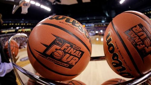 In this April 3, 2015, file photo, basketballs sit in a rack during Michigan State practice at the Final Four in Indianapolis. (AP Photo/David J. Phillip, File)