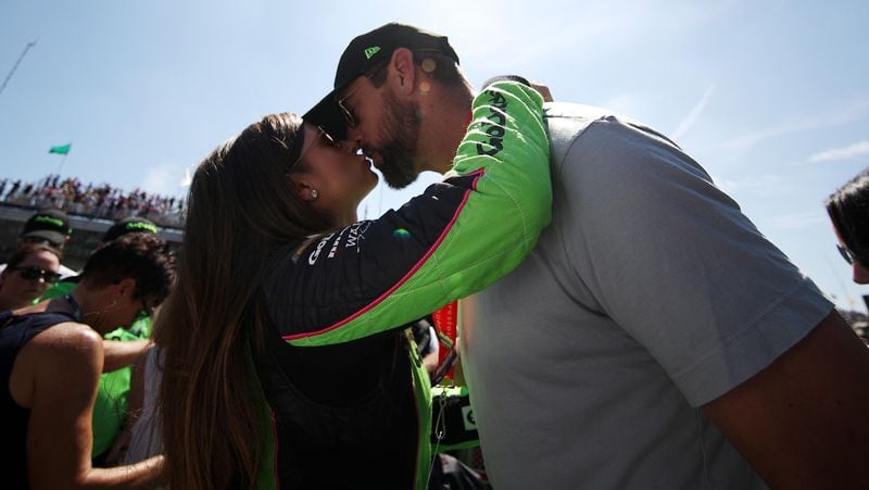 Danica Patrick kisses her boyfriend, Packers QB Aaron Rodgers, prior to the Indy 500.   (Photo by Chris Graythen/Getty Images)