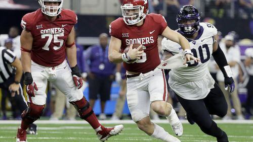Oklahoma quarterback Baker Mayfield (6), shown in action in the Big 12  championship game, is a finalist for two awards that will be presented in Atlanta this week.