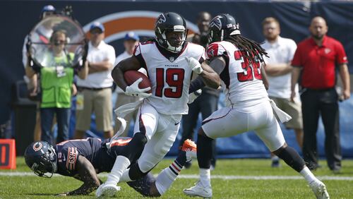 Atlanta Falcons' Andre Roberts (19) returns the opening kickoff during the first half of an NFL football game against the Chicago Bears, Sunday, Sept. 10, 2017, in Chicago. Chicago's Josh Bellamy is on the ground after being blocked in the back by Atlanta's Kemal Ishmael. (AP Photo/Nam Y. Huh)