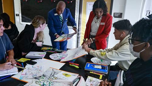 Gwinnett County Public Schools Superintendent Calvin Watts talks to a group of Archer High students in art class alongside Principal Conquisha Thompson in Lawrenceville on Thursday, Sept. 1, 2022. (Natrice Miller/natrice.miller@ajc.com)