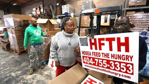 January 16, 2020 Atlanta: Hosea Williams III (from left), Hosea Feed the Hungry CEO Elisabeth Omilami, and Hopeton Gordon work at a rental warehouse while renovations are being made to the organizations existing location on Thursday, January 16, 2020, in Atlanta. Curtis Compton ccompton@ajc.com