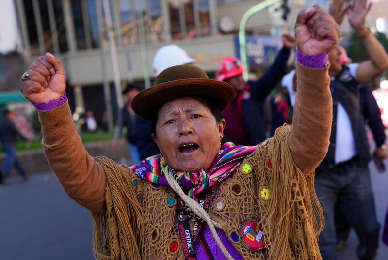 A woman attends the International Workers' Day march in La Paz, Bolivia, Wednesday, May 1, 2024. (AP Photo/Juan Karita)