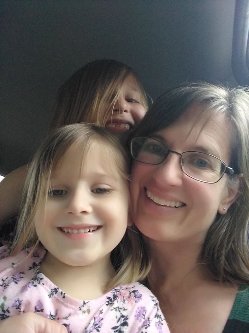 Rimbey Schroeder is with two of her daughters. The Schroeders are one of hundreds of families who call Norcross extended-stay motels home. CONTRIBUTED
