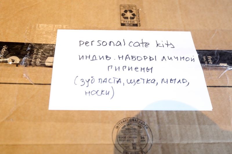 A box ready to ship shows what's inside in English and Ukrainian.  Miguel Martinez for The Atlanta Journal-Constitution 