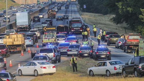 CHASE ENDS IN CRASH-- June 14, 2016 DeKalb County: One person was injured and three people were arrested Tuesday, June 14, 2016 after a Rockdale County sheriff's chase and multiple crashes in DeKalb County. At least seven cars were involved in the crashes, which temporarily blocked two of the four westbound lanes on I-20 at Panola Road at the height of the morning commute. "There were 3 hit-and-run accidents when a stolen vehicle pursued by Rockdale sheriff units struck these vehicles and continued," DeKalb police Maj. Stephen Fore said. "One person received minor injuries as a result of one [of] the accidents and was transported to DeKalb Medical." The incident started with the stolen truck. Corey James, who owns a black 2010 Cadillac Escalade, said someone took his truck during his daily trip to a local gas station. "I went inside the Shell gas station to get a pop, and in less than 2 minutes or so came out," James told The Atlanta Journal-Constitution. "The car was pulling off." He called 911 and told a dispatcher he saw the Escalade jump on I-20. That's when the Rockdale sheriff's pursuit began. Jawanda Murray was taking her husband to work and approaching a ramp at Panola Road when a car involved in the chase rear-ended hers. Officials were attempting a PIT maneuver, a tactic that essentially involves bumping a vehicle in an attempt to stop it. "It was out of control," Murray said. At the end of the chase, two guns were recovered and three people were arrested, a Rockdale sheriff's official said. All lanes have reopened, and I-20 was rapidly improving in DeKalb just before 9 a.m., according to the WSB 24-hour Traffic Center. No other details were released. JOHN SPINK /JSPINK@AJC.COM