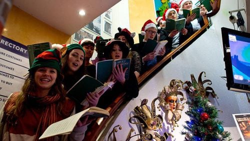 St Peter's College Oxford sing carols in Angels fancy dress shop to raise money to support the Crisis homeless persons charity on December 18, 2015 in London, England. The mixed-voice choir made of students from the college sing during the weekly Evensong services during term time.  (Photo by Ben Pruchnie/Getty Images)