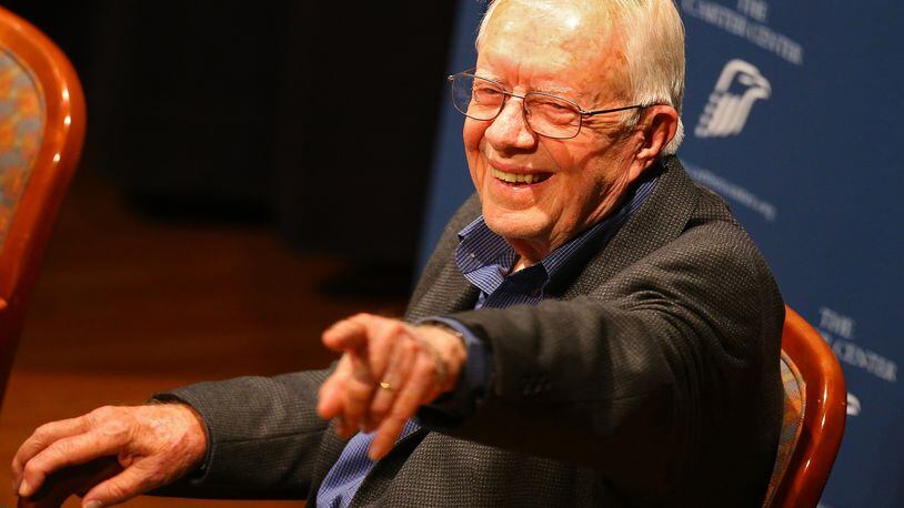 President Jimmy Carter points out a member of the audience during "Conversations at the Carter Center" discussing the centers ongoing and latest efforts around the world on Tuesday, Sept. 16, 2014, in Atlanta. CURTIS COMPTON / CCOMPTON@AJC.COM Former President Jimmy Carter. AJC file/Curtis Compton