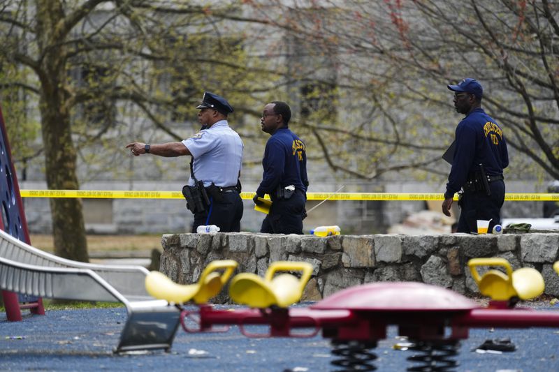 Investigators work the scene of a shooting at an Eid al-Fitr event in Philadelphia, Wednesday, April 10, 2024. (AP Photo/Matt Rourke)
