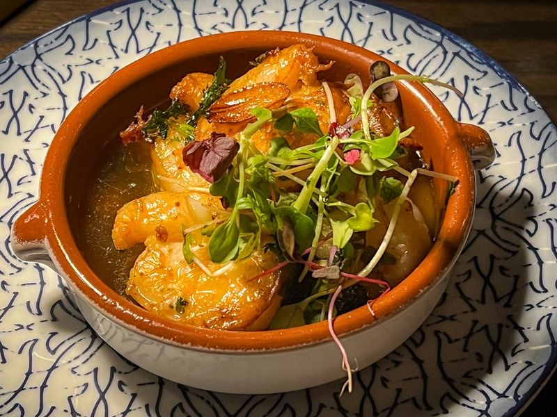 Silla del Toro's gambas al ajillo (shrimp in garlic) is served in a combination of butter, garlic and sherry. Henri Hollis/henri.hollis@ajc.com