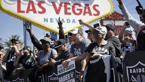 Fans cheer in 2017 as the Oakland Raiders announce their fourth round draft pick during an NFL football draft event in Las Vegas. The NFL for a long time so worried about being associated with gambling or sports betting that players were forbidden to go into casinos, and Las Vegas overall was suspect. Georgia lawmakers are now considering legalizing mobile sports betting, as are other states.(AP Photo/John Locher, File)
