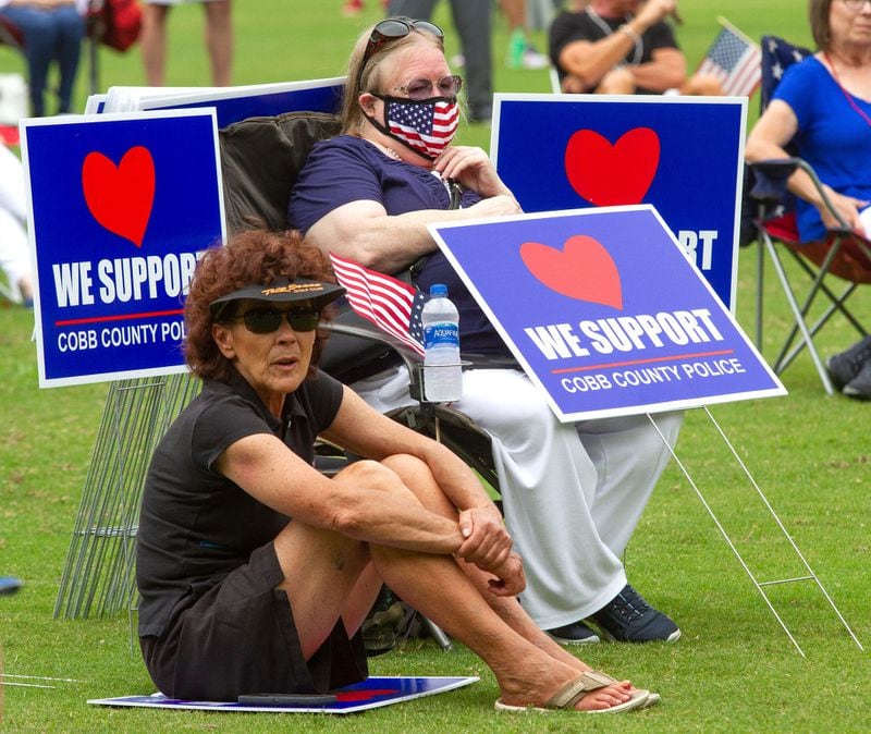 Demonstrators listen to the speakers at a rally in support of law enforcement and first responders Saturday, June 27, 2020 at Lost Mountain Park in Powder Springs .