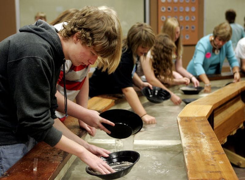 Thirteen-year-old Hunter Whited pans for gems with his group from Trion Middle School.
