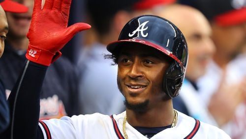 March 29, 2018 Atlanta: Braves second baseman Ozzie Albies celebrates hitting a solo homerun against the Phillies during the eight inning in a MLB baseball home opening game on Thursday, March 29, 2018, in Atlanta.  Curtis Compton/ccompton@ajc.com