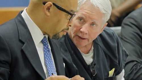 Claud “Tex” McIver, right, confers with attorney William Hill on Thursday. McIver was back in court for pretrial motions in advance of his murder trial on Oct 30. BOB ANDRES /BANDRES@AJC.COM