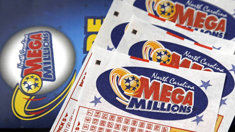 This 2016 file photo shows Mega Millions lottery tickets on a counter. After nearly three months without a winner, the Mega Millions lottery game has climbed to an estimated $654 million jackpot.