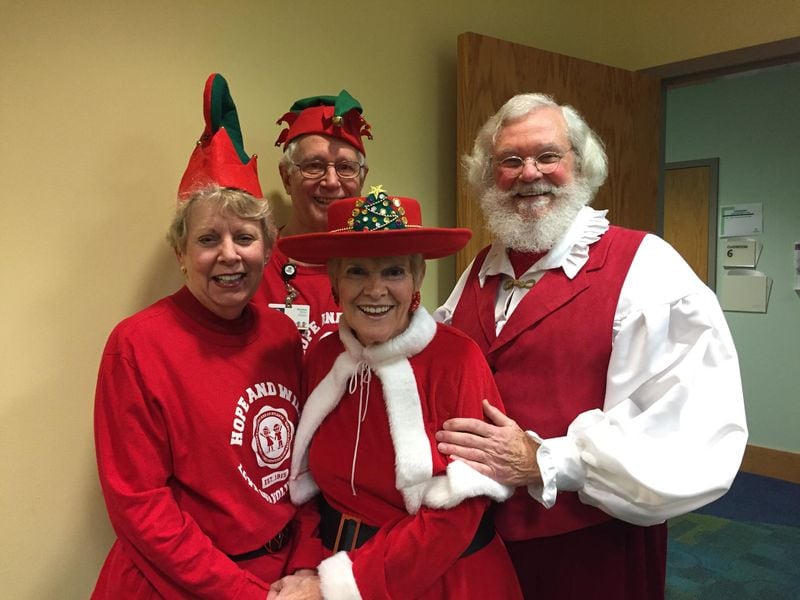 Here is Santa with his elves.
