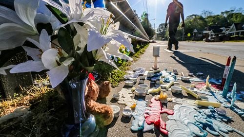 A memorial was growing Mon., April 18, 2016, at the site where three children were struck by a vehicle that jumped a curb in northwest Atlanta. JOHN SPINK / JSPINK@AJC.COM