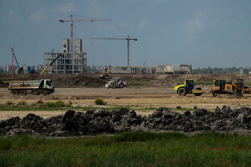 FILE- Construction is underway for a battery factory for electric vehicles built by China-based Contemporary Amperex Technology Co. Limited (CATL) in Debrecen, Hungary on Tuesday, May 23, 2023. Hungary's government has deepened its economic ties with China, with the proliferation of Chinese electric vehicle (EV) battery factories across the country gaining the most attention. Near Debrecen, construction is underway of a nearly 550-acre, 7.3 billion euro ($7.9 billion) EV battery plant, Hungary's largest-ever foreign direct investment. (AP Photo/Denes Erdos, File)
