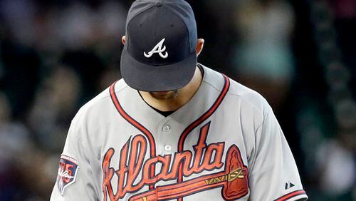 Atlanta Braves starting pitcher Mike Minor hangs his head after giving up a three-run homer to Houston Astros' Matt Dominguez in the fifth inning of a baseball game Thursday, June 26, 2014, in Houston. (AP Photo/Pat Sullivan)