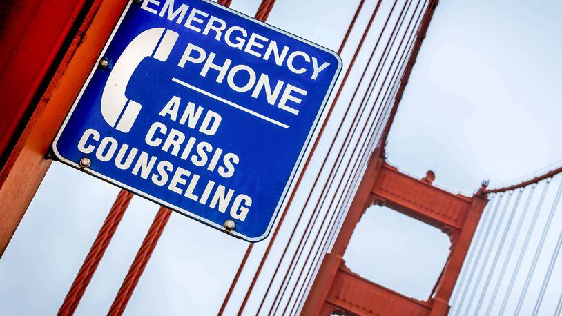 A crisis counseling sign on the Golden Gate Bridge, San Francisco. Thanks to a recent change, callers in crisis can just dial 988 to reach the 988 Suicide and Crisis Lifeline. (Dan Henson/Dreamstime/TNS)