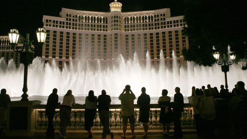 Tourists line up in front of the Bellagio in Las Vegas to watch the water show in an October 2007 file image. (Mark Boster/Los Angeles Times/TNS)