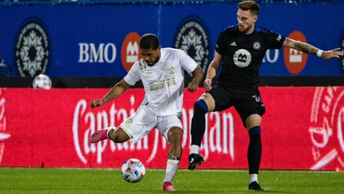 Atlanta United forward Josef Martinez (7_ dribbles the ball during the first half of the match against Montreal Saturday, Oct. 2, 2021, at Stade Saputo in Montreal, Quebec. (Audrey Magny/Atlanta United)
