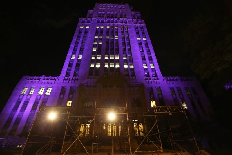 Atlanta City Hall is lit in purple in remembrance of Prince on Friday night April 22, 2016, the day after the musical superstar was found dead in his Minnesota home. Ben Gray / bgray@ajc.com