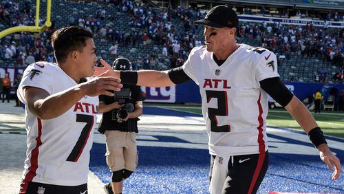 Atlanta Falcons kicker Younghoe Koo (7) and quarterback Matt Ryan (2) celebrate after their win over the New York Giants Sunday, Sept. 26, 2021, in East Rutherford, N.J. (Bill Kostroun/AP)