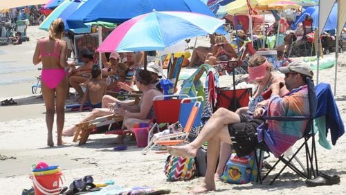 People enjoyed East Beach on St. Simons Island Tuesday, July 14, 2020. RYON HORNE / RHORNE@AJC.COM