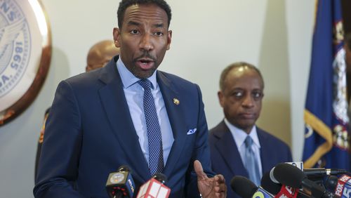 Atlanta Mayor Andre Dickens speaks to the media next to Dekalb County CEO Michael Thurmond, right, during a press conference about the planned Atlanta Public Safety Training Center at Atlanta City Hall, Tuesday, January 31, 2023, in Atlanta. Jason Getz / Jason.Getz@ajc.com)