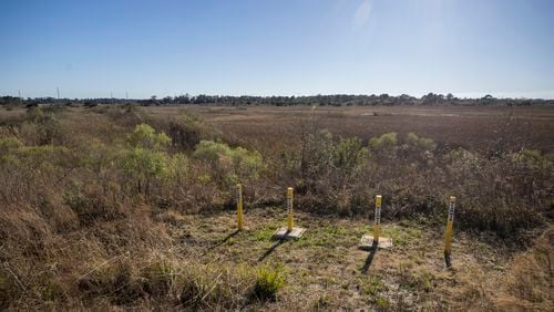 SAVANNAH, GA - JANUARY 29, 2024: Four vertical wells stand on the edge of a 750 acre marsh that borders the SeaPoint property. SeaPoint donated the marsh to the state and continues to monitor for any contamination. (Stephen B. Morton for the AJC)