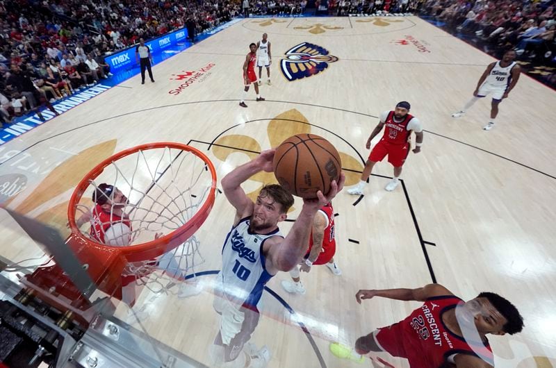 Sacramento Kings forward Domantas Sabonis (10) goes to the basket in the second half of an NBA basketball play-in tournament game against the New Orleans Pelicans in New Orleans, Friday, April 19, 2024. The Pelicans won 105-98. (AP Photo/Gerald Herbert)