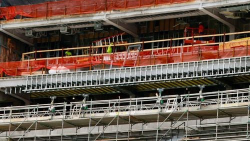 Construction workers were spotted carrying out renovations at Sanford Stadium on Monday, April 29, 2024. The renovations involve expanding the 100-level south sideline concourse, establishing the 50-Yard Line Club, and constructing a new press box with premium seating options.
(Miguel Martinez / AJC)