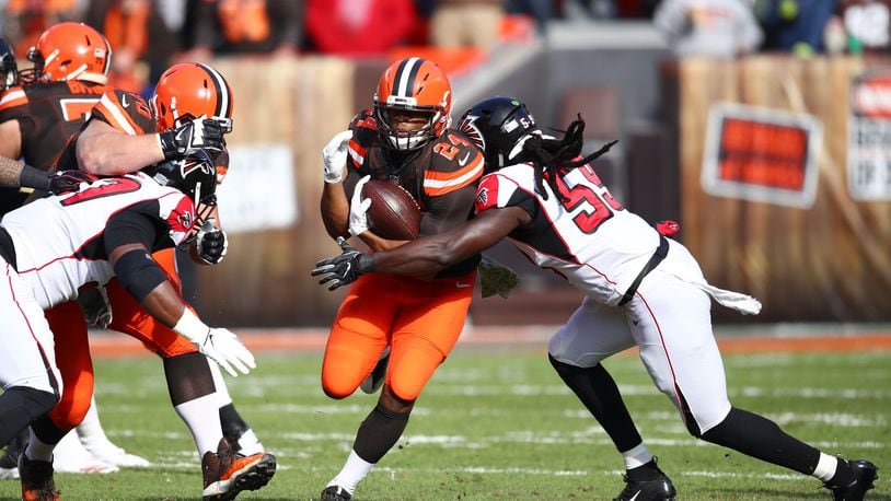 CLEVELAND, OH - NOVEMBER 11: Nick Chubb #24 of the Cleveland Browns runs the ball defended by De'Vondre Campbell #59 of the Atlanta Falcons in the first quarter at FirstEnergy Stadium on November 11, 2018 in Cleveland, Ohio. (Photo by Gregory Shamus/Getty Images)