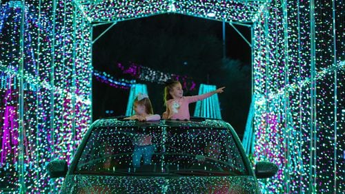 Youngsters are thrilled by the light show at the World of Illumination’s Reindeer Road. 
(Courtesy of World of Illumination’s Reindeer Road)
