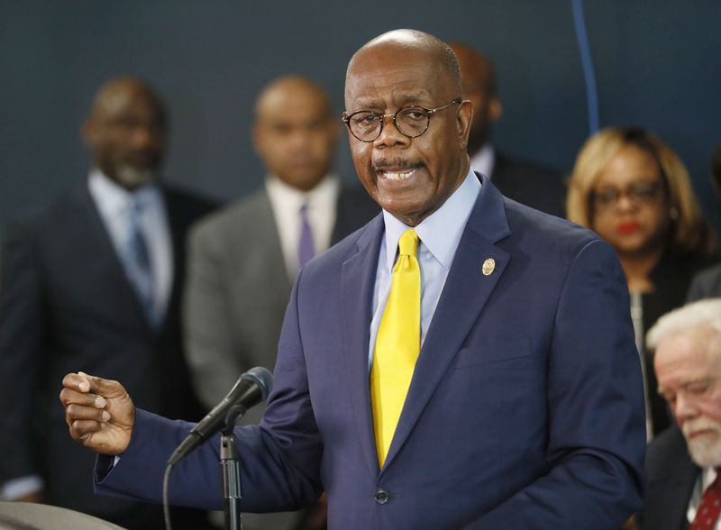 March 21, 2019 - Atlanta - Fulton County district attorney Paul Howard (right) addresses the media in this file photo. 