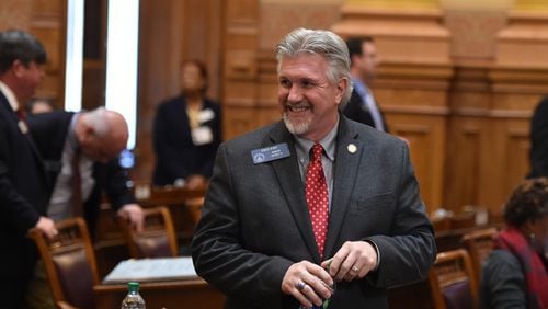 Greg Kirk-R celebrates the passage of HB 757 in the Senate on Friday. Brant Sanderlin, bsanderlin@ajc.com