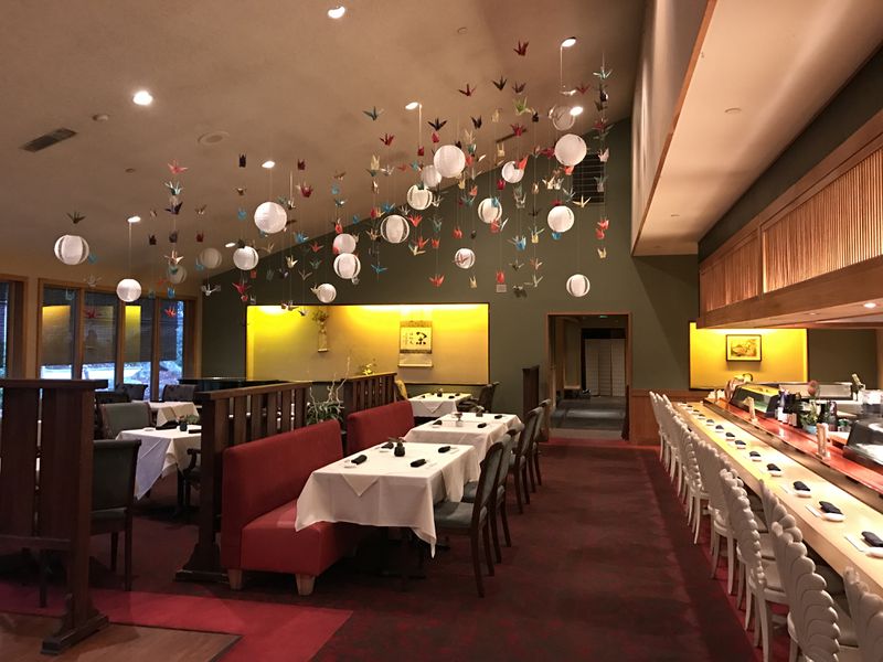 The Nakato dining room features hundreds of Japanese origami cranes (symbolizing peace and longevity), created for the restaurant’s 45th anniversary. Courtesy of Nakato Japanese Restaurant
