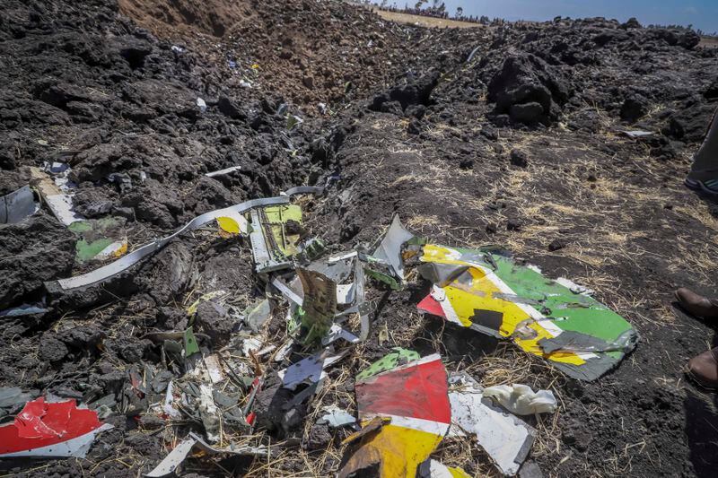 FILE - Wreckage lies at the scene of an Ethiopian Airlines flight of a Boeing 737 Max 8 plane that crashed shortly after takeoff at Hejere near Bishoftu, or Debre Zeit, some 50 kilometers (31 miles) south of Addis Ababa, Ethiopia, March 10, 2019. Boeing said Wednesday, April 24, 2024, that it lost $355 million on falling revenue in the first quarter, another sign of the crisis gripping the aircraft manufacturer as it faces increasing scrutiny over the safety of its planes and accusations of shoddy work. (AP Photo, File)