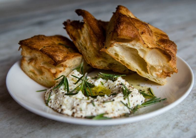 Warm focaccia at Bar Americano is served with whipped ricotta and olive oil for dipping. CONTRIBUTED BY HENRI HOLLIS