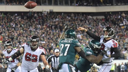 Atlanta Falcons quarterback Matt Ryan (2) gets off a pass under pressure from Philadelphia Eagles defensive tackle Fletcher Cox (91) in the second first during the NFC Divisional Game at Lincoln Financial Field in Philadelphia, PA on Saturday, January 13, 2018. The Falcons' quest for a return to the Super Bowl ended with a loud thud Saturday in a 15-10 loss to the Eagles in an NFC Divisional playoff game at Lincoln Financial Field.  HYOSUB SHIN / HSHIN@AJC.COM
