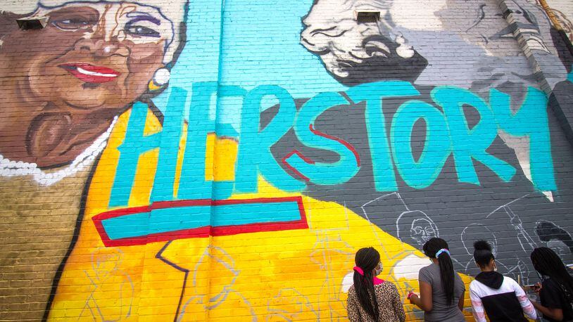 The mural, “Heroine: Unsung Women Involved in Civil and Social Justice,” covers the east side of the West End Goodwill store. STEVE SCHAEFER / FOR THE AJC